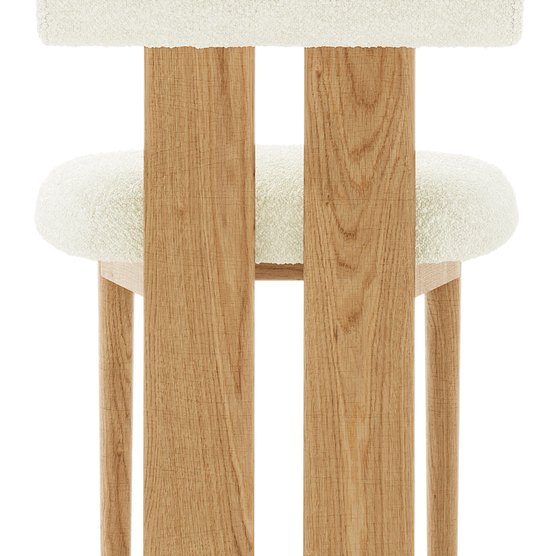 Wylie Boucle Oak Dining Chair Set features a close-up of the plush boucle fabric seat and backrest, solid oak frame, and oak-paneled legs, showcasing its elegant and sturdy design.