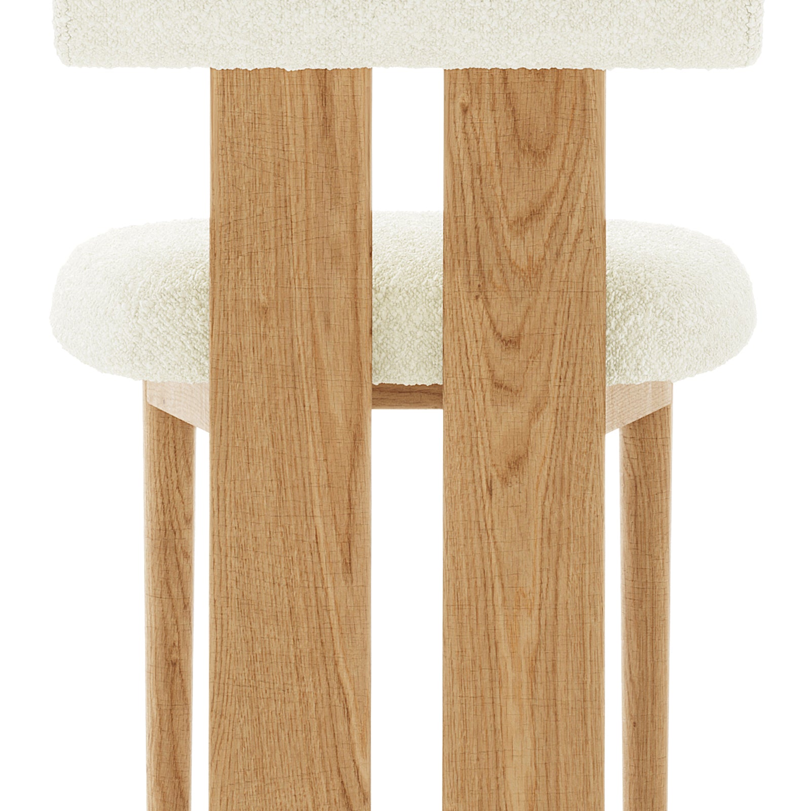 Wylie Boucle Oak Dining Chair Set features a close-up of the plush boucle fabric seat and backrest, solid oak frame, and oak-paneled legs, showcasing its elegant and sturdy design.