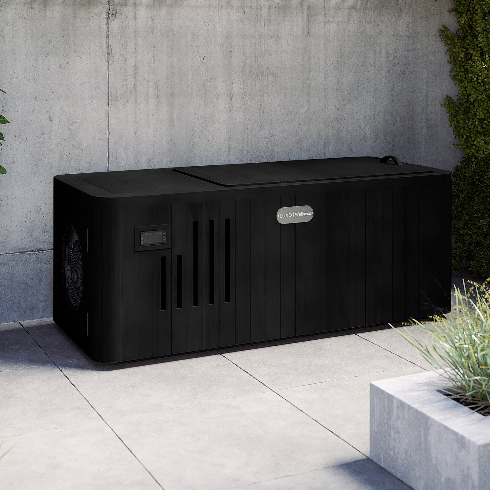 Lambert 2-Person 1HP Chiller Ice Bath in Black, featuring a closed slatted cover, control panel, and vented openings, sits on a gray tiled patio with a planter and climbing vines nearby.