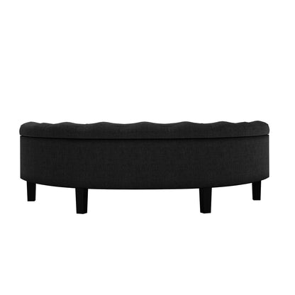Amina Half Round Linen Fabric Ottoman in Black, featuring a semi-circular design with a tufted top, dark-stained wooden legs, and plush cushioning, ideal for elegant home decor and versatile functionality.