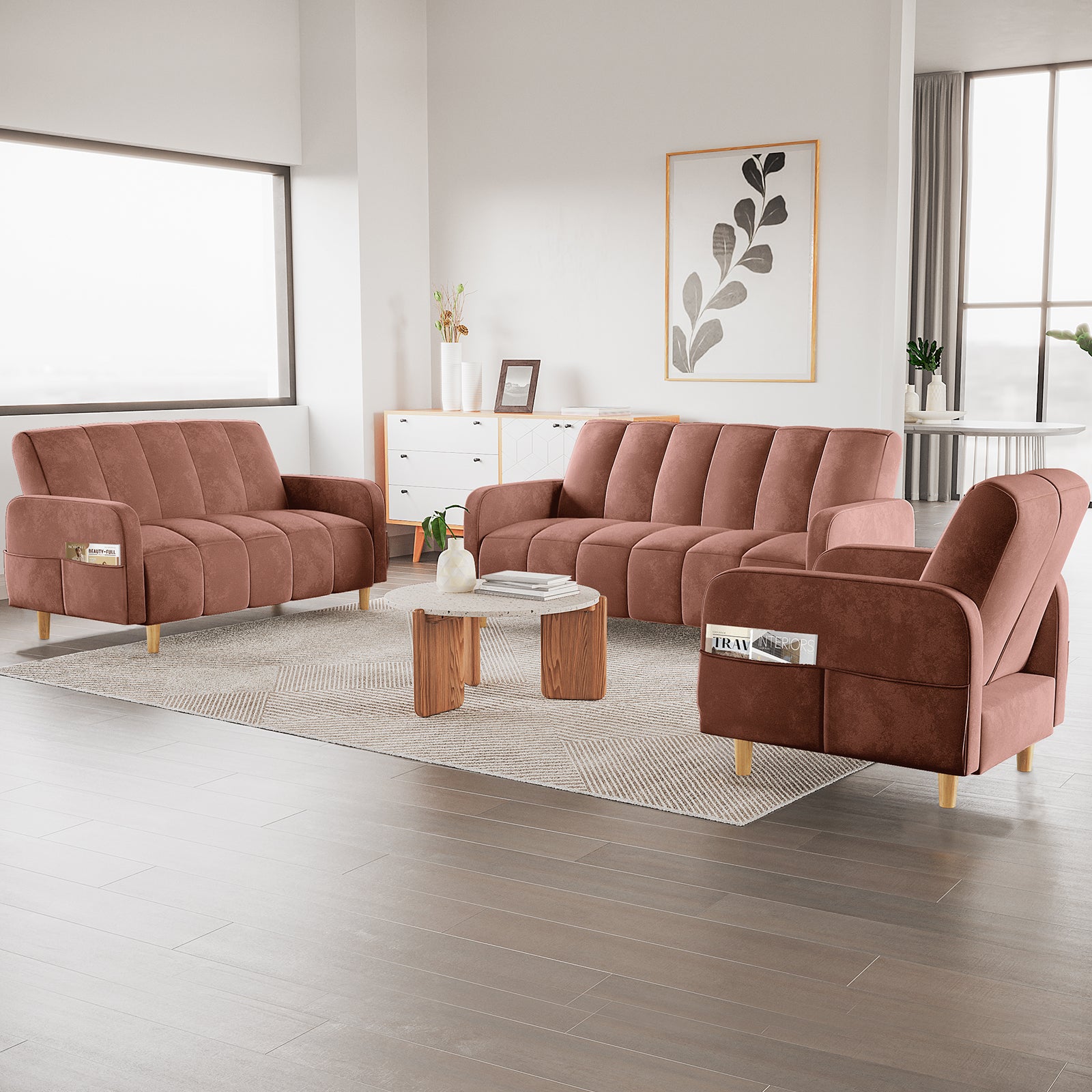 Anica 6 Seater Velvet Fabric Sofa Bed Set in Blush, featuring channel-stitched upholstery, modular design with a three-seater, loveseat, and armchair, complemented by a modern round coffee table and sleek decor.