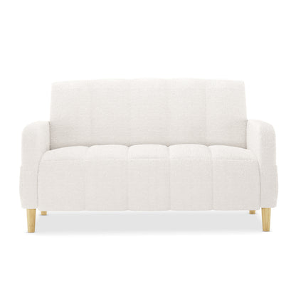 Anica 6 Seater Boucle Sofa Bed Set in Cream White features a light-cream, bouclé-style loveseat with vertical channel tufting, rounded arms, and short, tapered wooden legs, epitomizing modern elegance.