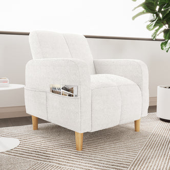 Anica Single Seater Bouclé Sofa Chair in Cream White, featuring rounded arms, reclined back, light-wood tapered legs, and a side pocket with magazines, set on a patterned area rug.