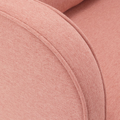 Close-up of the Aura Linen Rocking Chair with Ottoman in Light Pink, showcasing its upholstered arm in soft pinkish-coral fabric with visible piping along the curved edge.