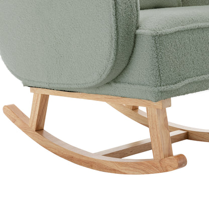 Aura Boucle Rocking Chair with Ottoman in Mint Green featuring sherpa-style fabric and pale wood rocker rails and supports, highlighting its chic, modern design and inviting texture.