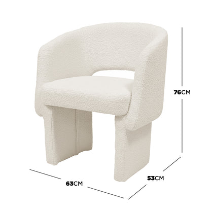 Avela Boucle Fabric Curved Accent Armchair in Cream White features a modern, off-white boucle upholstery, curved low back, armrests, thick padded seat, and wide block-style legs.