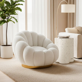 Beare Boucle Swivel Gold Base Accent Chair in Cream White, featuring a sculptural shell-inspired design with a luxurious bouclé fabric and elegant gold swivel base, positioned in a cozy, minimalist living room setting.