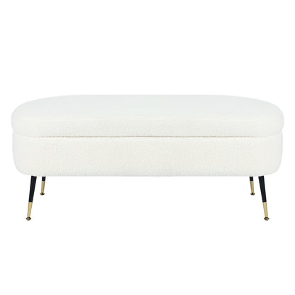 Bella 114cm Boucle Ottoman with Storage in Cream White features a modern design with a rounded top, slender black metal legs with brass feet, and boucle fabric, offering both style and practicality.