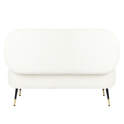 Bella 114cm Boucle Ottoman with Storage in Cream White; features a rounded back cushion, pill-shaped seat, white bouclé fabric, and slender black metal legs with brass tips, offering stylish extra seating and storage.