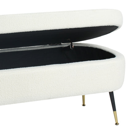 Bella 114cm Boucle Ottoman with Storage in Cream White, featuring a hinged top open, displaying a black-lined interior. Upholstered in boucle fabric, it stands on tapered metal legs with brass-colored feet.