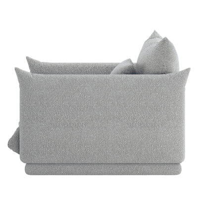 Berlin Single Seater Boucle Sofa with Pillow in Grey, featuring a modern design with boxy arms and multiple matching throw cushions, viewed from the side. Upholstered in light gray fabric.