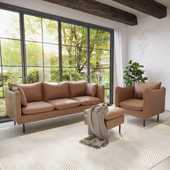 Cassian 5 Seater PU Leather Sofa Set in Chocolate Brown, featuring a three-seat sofa, matching armchair, and ottoman with a gray throw, set against black-framed windows and wooden beams.