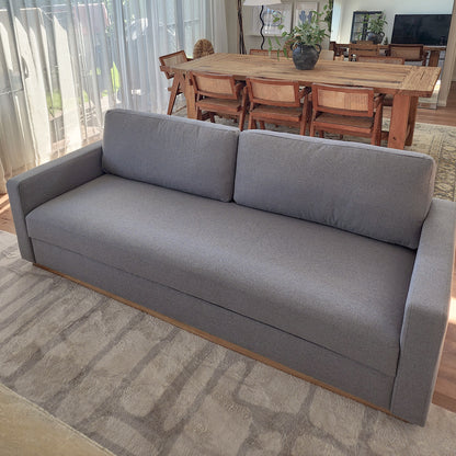 Celeste 3 Seater Hardwood Fabric Sofa Ash, displayed in a cozy room setting, showcasing its elegant rubber wood legs, removable cushions, and sturdy frame for modern living room comfort.