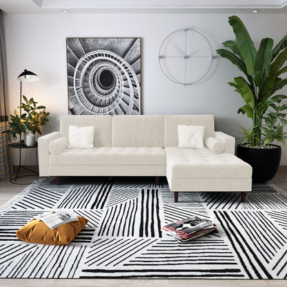 Claude 3 Seater Velvet Sofa with Chaise – Cream is displayed in a stylish interior setting, showcasing its luxurious velvet upholstery, plush cushions, and a spacious chaise design for optimal lounging.