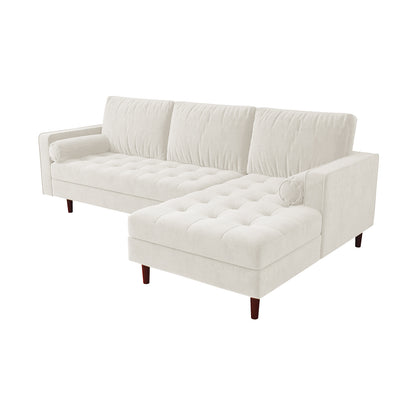 Close-up of the Claude 3 Seater Velvet Sofa with Chaise – Cream, showcasing its plush cushions and spacious chaise design, emphasizing luxurious comfort and style in a modern living room setting.