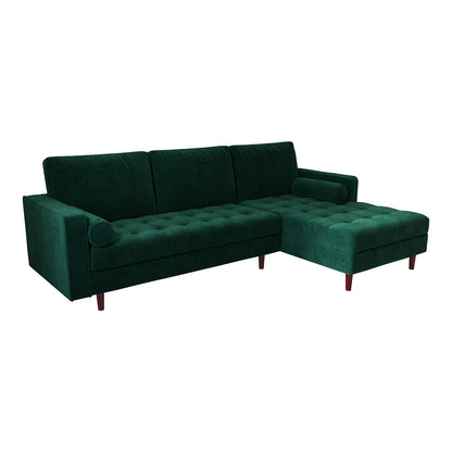 Close-up of the Claude 3 Seater Velvet Sofa with Chaise in Dark Forest Green, showcasing its plush velvet upholstery, fixed cushions, and solid wood frame, embodying modern elegance and comfort.