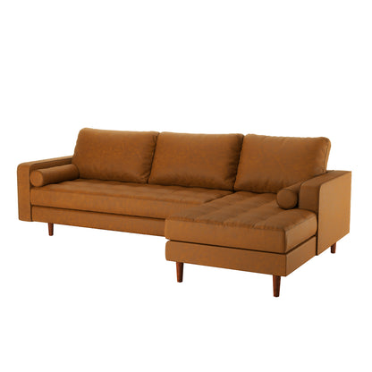 Claude 3 Seater PU Leather Sofa with Chaise in Tan Brown features mid-century style, L-shaped design, cognac leather upholstery, three back cushions, chaise on right, bolster pillows, tapered wooden legs.