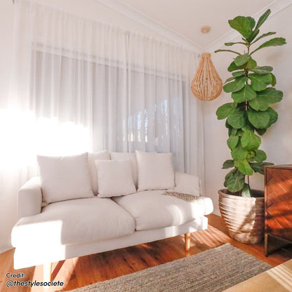 Colton 3-Seater Fabric Sofa Cream White showcased in a cozy setting, featuring plush cushions and a sleek design, perfect for modern interiors.