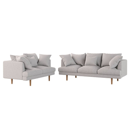 Colton 5-Seater Fabric Sofa in Stone with low, boxy profile, loose cushions, and short, tapered wooden legs, forming a modular arrangement for modern, comfortable living spaces.