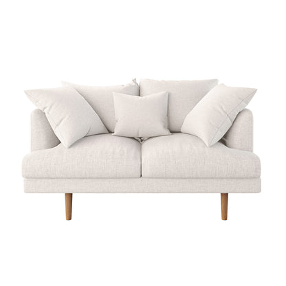 Colton 2 Seater Fabric Sofa Cream White on a white couch, featuring sleek design, soft cushions, and solid wood legs, showcasing its modern style and comfort.
