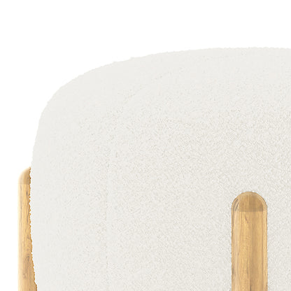 Conchita Boucle Ottoman Stool with cream-colored boucle upholstery, rounded corners, and natural-finish wooden legs, showcasing its elegant and cosy design, perfect for versatile home use.