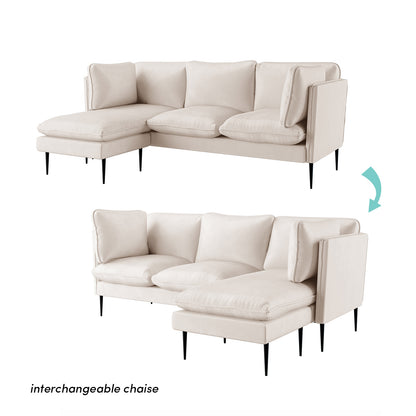 Erling 3 Seater Velvet Sofa with Chaise in a studio setting, highlighting plush foam cushions and sleek armrest, showcasing the sofa's luxurious design and modern appeal.