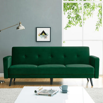 Esben 3 Seater Velvet Sofa Bed in a room, showcasing its plush velvet fabric and solid wooden legs, embodying Scandinavian and contemporary design.
