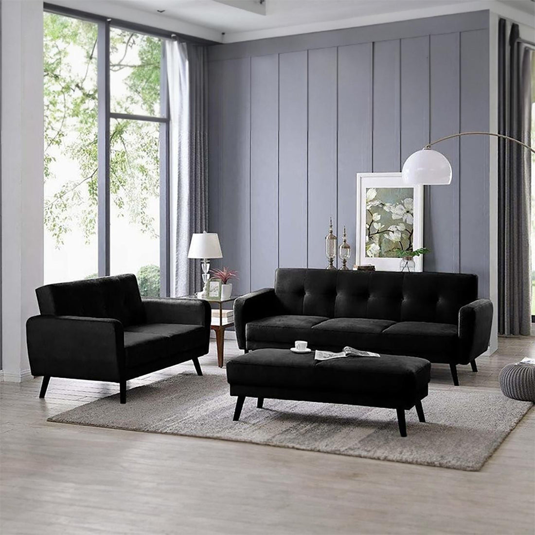 Esben 6-Seater Velvet Sofa Bed Set w/ Ottoman Black displayed in a modern living room setting, showcasing its sleek design and wooden legs, with the option to convert into two beds for versatile use.