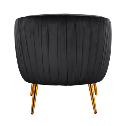 Evelyn Curved Velvet Sofa Accent Chair in Black featuring a sleek, pleated velvet upholstery and supported by three angled, slim gold-metal legs, exuding mid-century modern elegance and luxury.