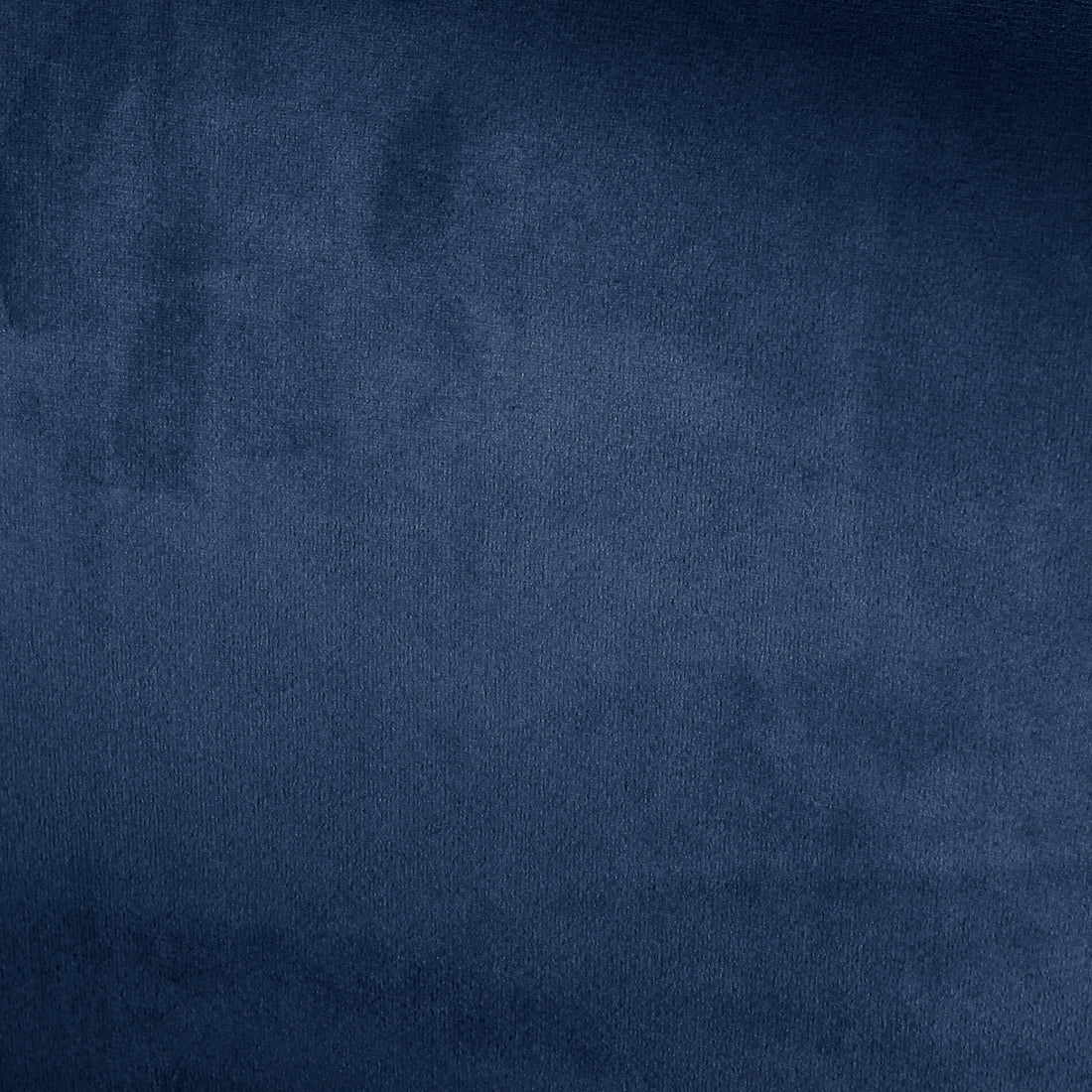 Close-up of the Evelyn Curved Velvet Sofa Accent Chair in Blue, highlighting its textured velvet upholstery with visible soft pile and subtle fabric folds, epitomizing luxury and mid-century modern design.