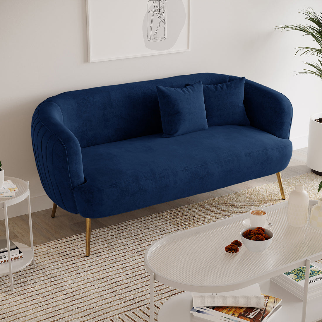 Evelyn 2 Seater Velvet Sofa Blue, showcasing elegant curves and vertical lines with gold legs, upholstered in luxurious velvet, enhancing its sophisticated and timeless appeal. Ideal for chic, modern interiors.