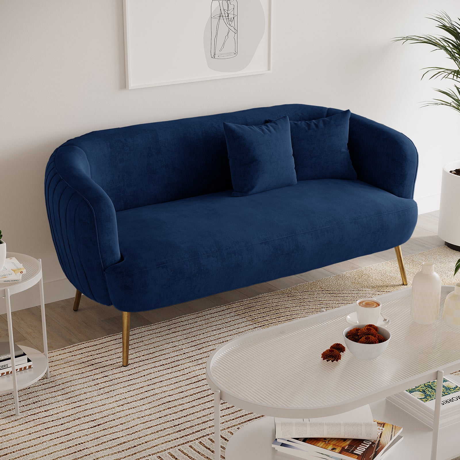 Evelyn 2 Seater Velvet Sofa Blue, showcasing elegant curves and vertical lines with gold legs, upholstered in luxurious velvet, enhancing its sophisticated and timeless appeal. Ideal for chic, modern interiors.