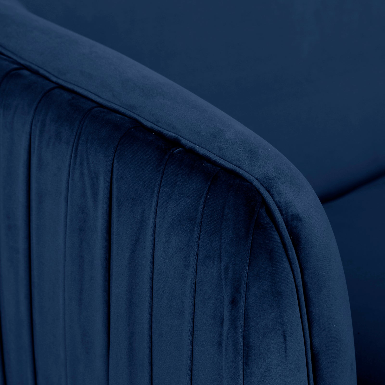 Evelyn 2 Seater Velvet Sofa Blue features a close-up of plush velvet upholstery with elegant vertical lines and gold-accented legs, showcasing its mid-century modern design and luxurious comfort.