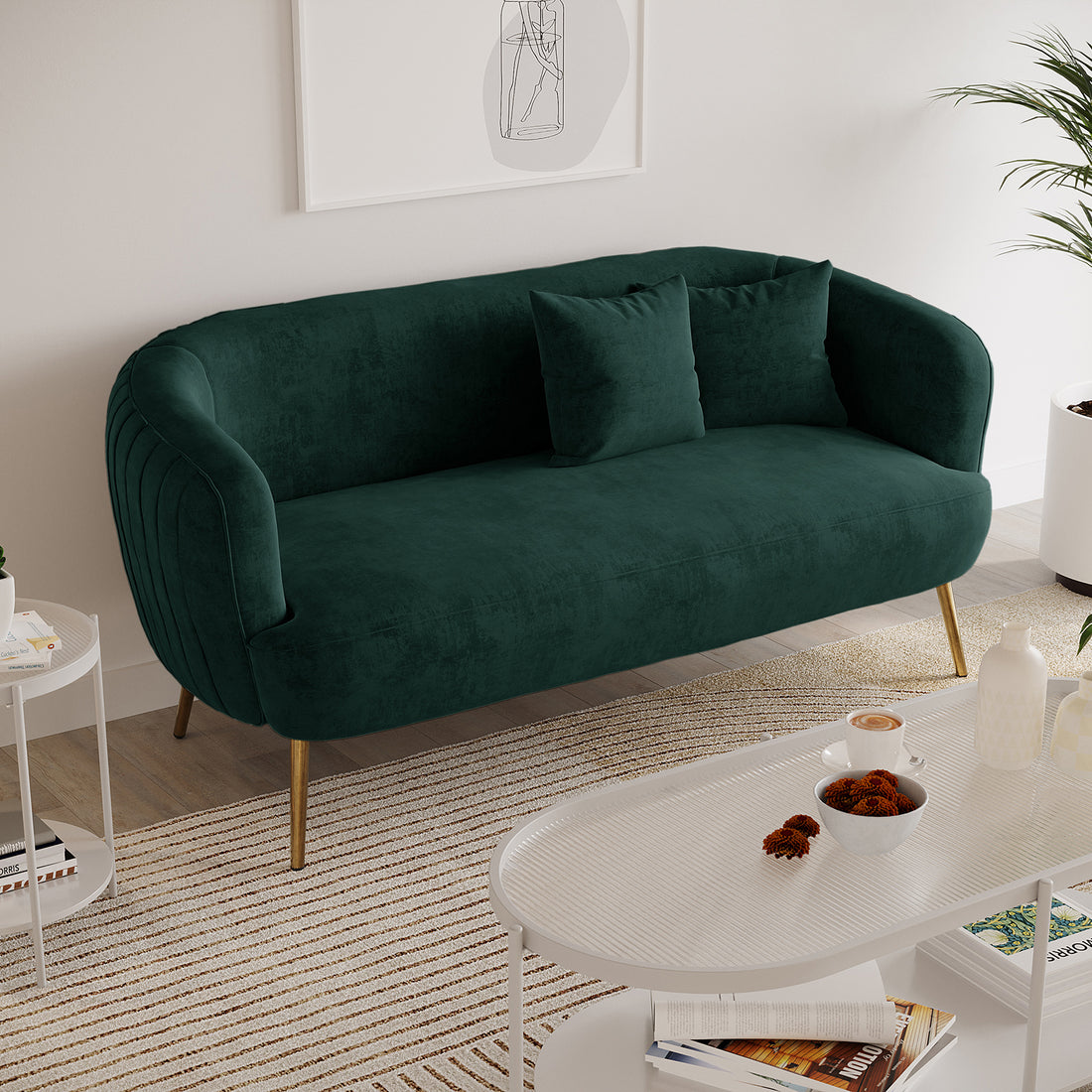 Evelyn 2 Seater Velvet Sofa Green features plush velvet upholstery, elegant curves, and sleek gold legs, offering a chic, mid-century modern look with cozy seating for two.
