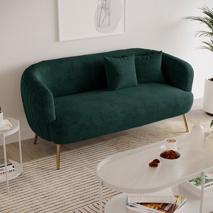 Evelyn 2 Seater Velvet Sofa Green features plush velvet upholstery, elegant curves, and sleek gold legs, offering a chic, mid-century modern look with cozy seating for two.