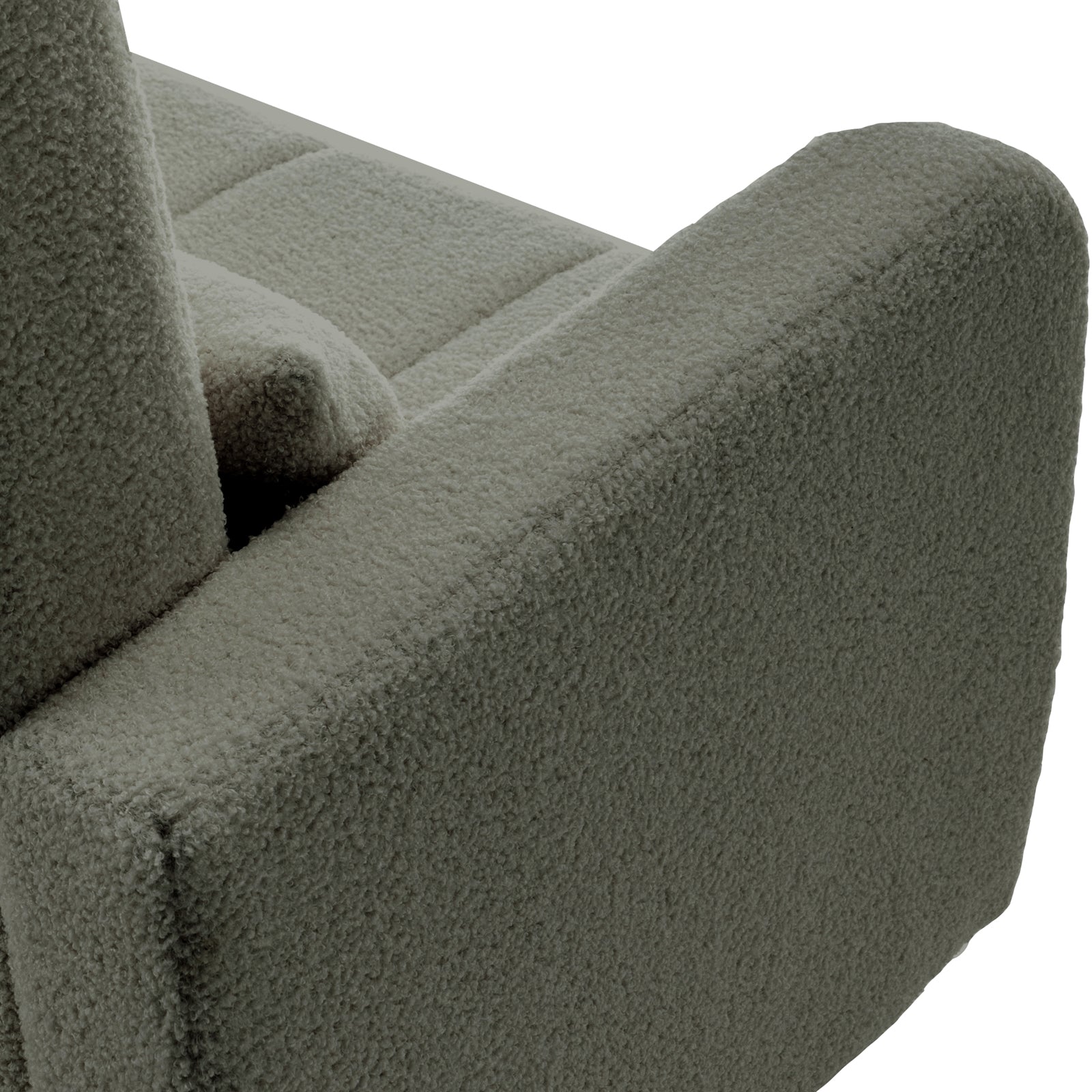 Close-up of the Gamila Boucle Rocking Chair with Ottoman in Green, showcasing the corner with an armrest and part of the seat/back cushions in looped bouclé fabric.