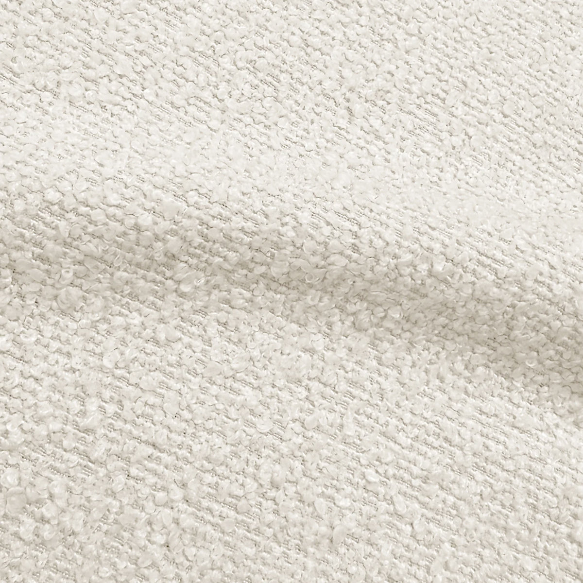 Close-up of textured cream bouclé upholstery fabric highlighting its soft, looped weave.   