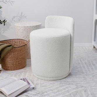 Close-up of the Hiboa Bouclé Ottoman Stool showcasing its soft, textured bouclé fabric and curved design, ideal for adding cosy charm and versatile seating to any modern living space.