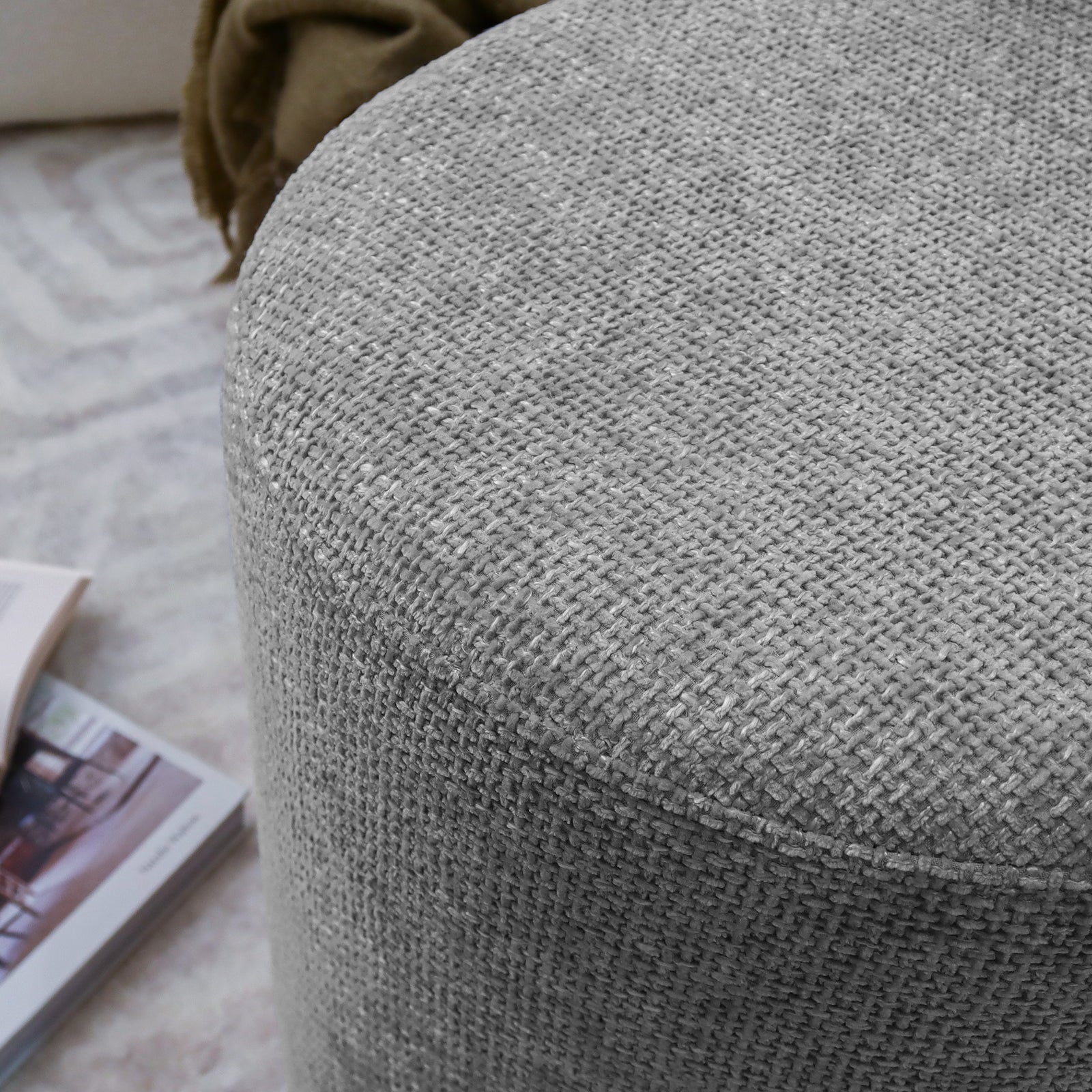 Close-up of the Hiboa Chenille Ottoman Stool in Warm Grey, showcasing its soft chenille fabric and plush cushioning, ideal for seating or as a footrest, enhancing living spaces with modern elegance.