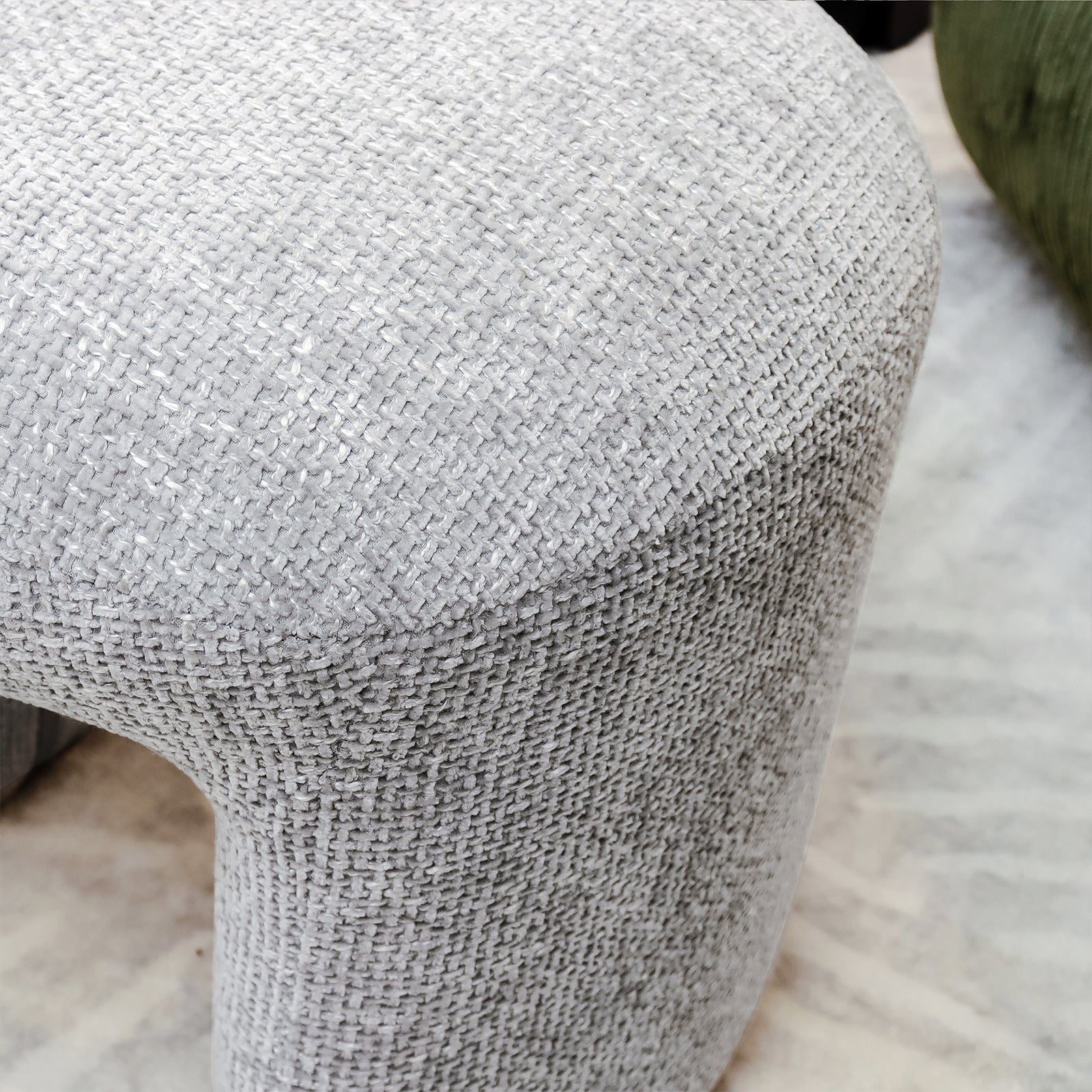 Hirokoz Chenille Ottoman Stool Warm Grey featuring plush chenille fabric and sturdy wood frame, showcasing a close-up of its textured surface and stitching detail, highlighting its modern, elegant design.