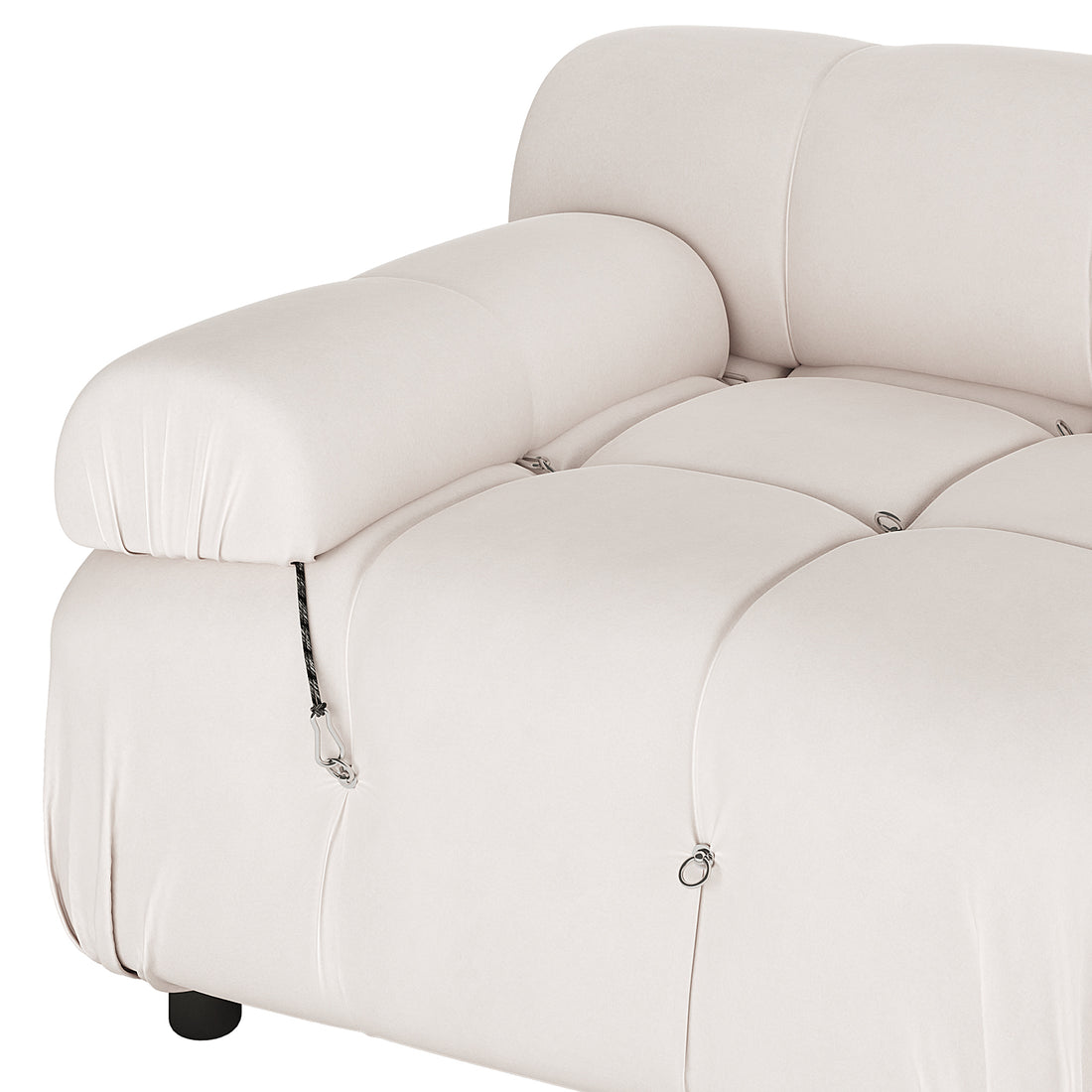 Keila 3 Seater Modular Tufted Sofa with Ottoman in Cream, featuring tufted seat cushions, small metal rings, and an adjustable headrest/armrest attached with a cord and carabiner clip.