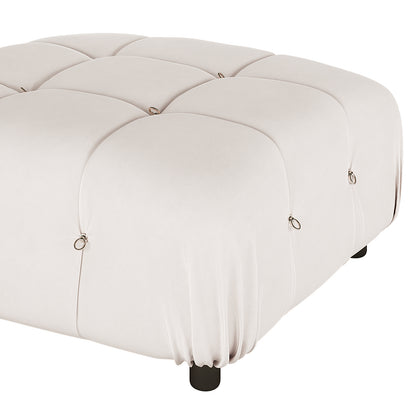 Keila 3 Seater Modular Tufted Sofa with Ottoman in Cream, featuring a square, light-cream upholstered ottoman with a grid-tufted pattern, metal ring accents, and short round legs for modern elegance.