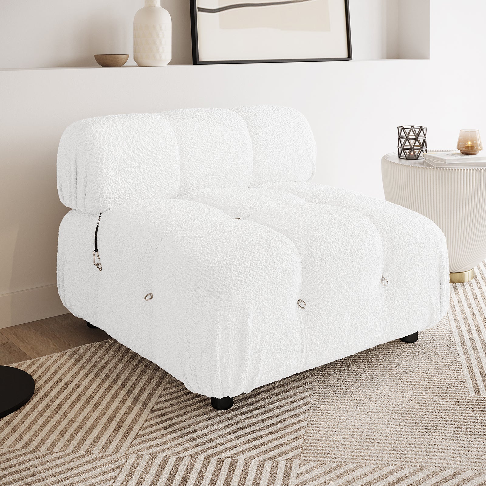 Keila Modular Tufted Boucle Single Sofa in Cream White, featuring an oversized design with button-tufted cushions, showcased in a minimal living nook with a geometric rug and modern decor elements.