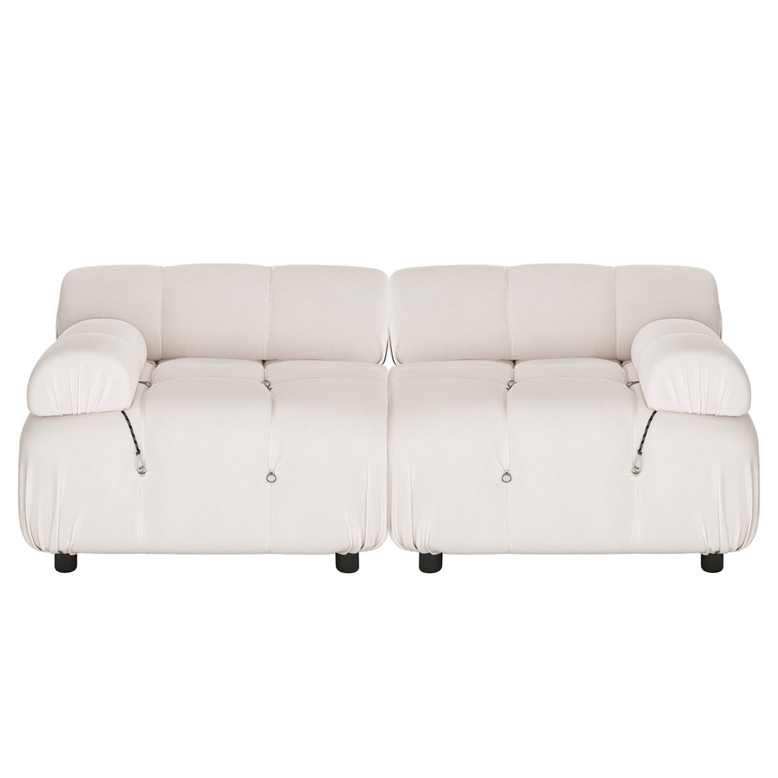 Keila 2 Seater Modular Tufted Sofa Set in Cream Velvet features a low-slung, puffy silhouette with tufted cushions, wide padded armrests, and short dark legs, exuding a contemporary, cozy charm.