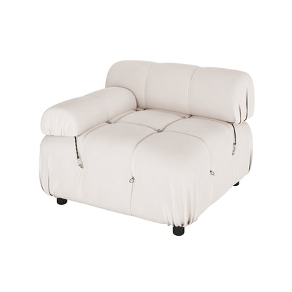 Keila 2 Seater Modular Tufted Sofa Set in Cream Velvet, featuring a light beige, tufted, single-seat section with deep cushioning, a low backrest, one padded armrest, and decorative loops at tuft intersections.
