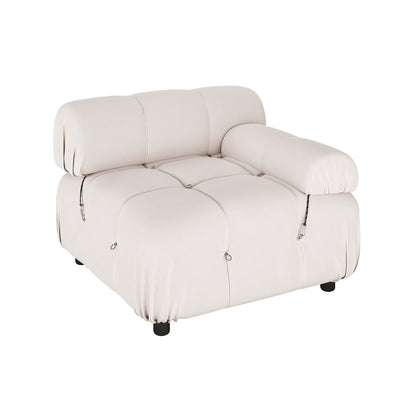 Keila 2 Seater Modular Tufted Sofa Set in Cream Velvet features a soft, tufted seat, rolled backrest cushion, black legs, and decorative seam details, offering comfort and elegance.