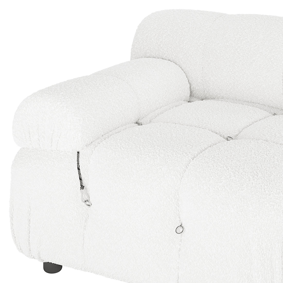 Keila 2 Seater Modular Tufted Boucle Sofa Set features a plush, tufted seat and armrest, decorative metal rings, short cord detail, and a visible black foot, showcasing modern design elegance.