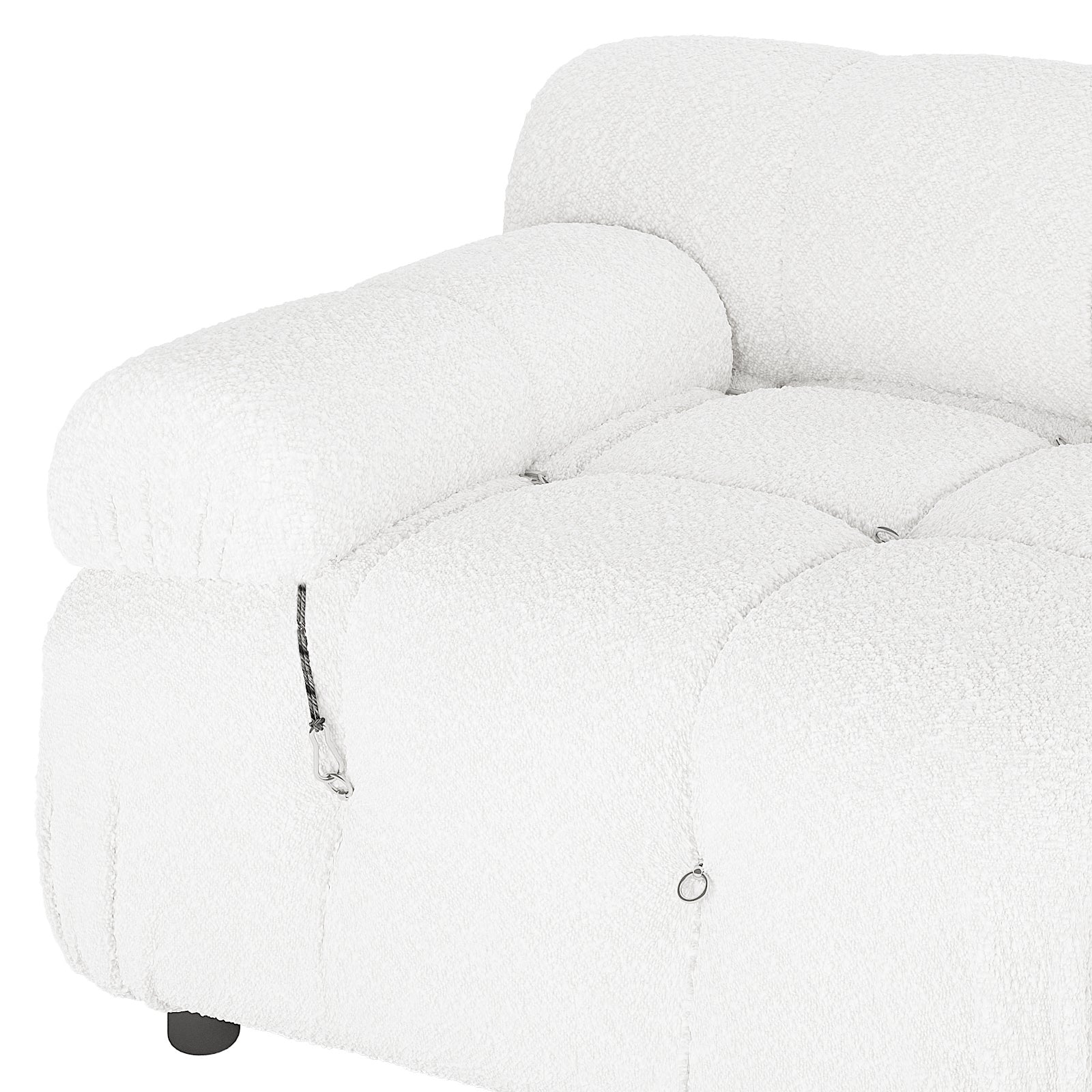 Keila 2 Seater Modular Tufted Boucle Sofa Set features a plush, tufted seat and armrest, decorative metal rings, short cord detail, and a visible black foot, showcasing modern design elegance.