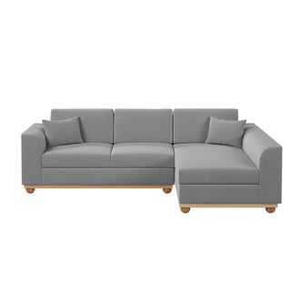 Laylah 3 Seater Hardwood Fabric Sofa With Right Chaise, highlighting its plush cushions and sturdy construction, perfect for relaxation and style in a modern living space.