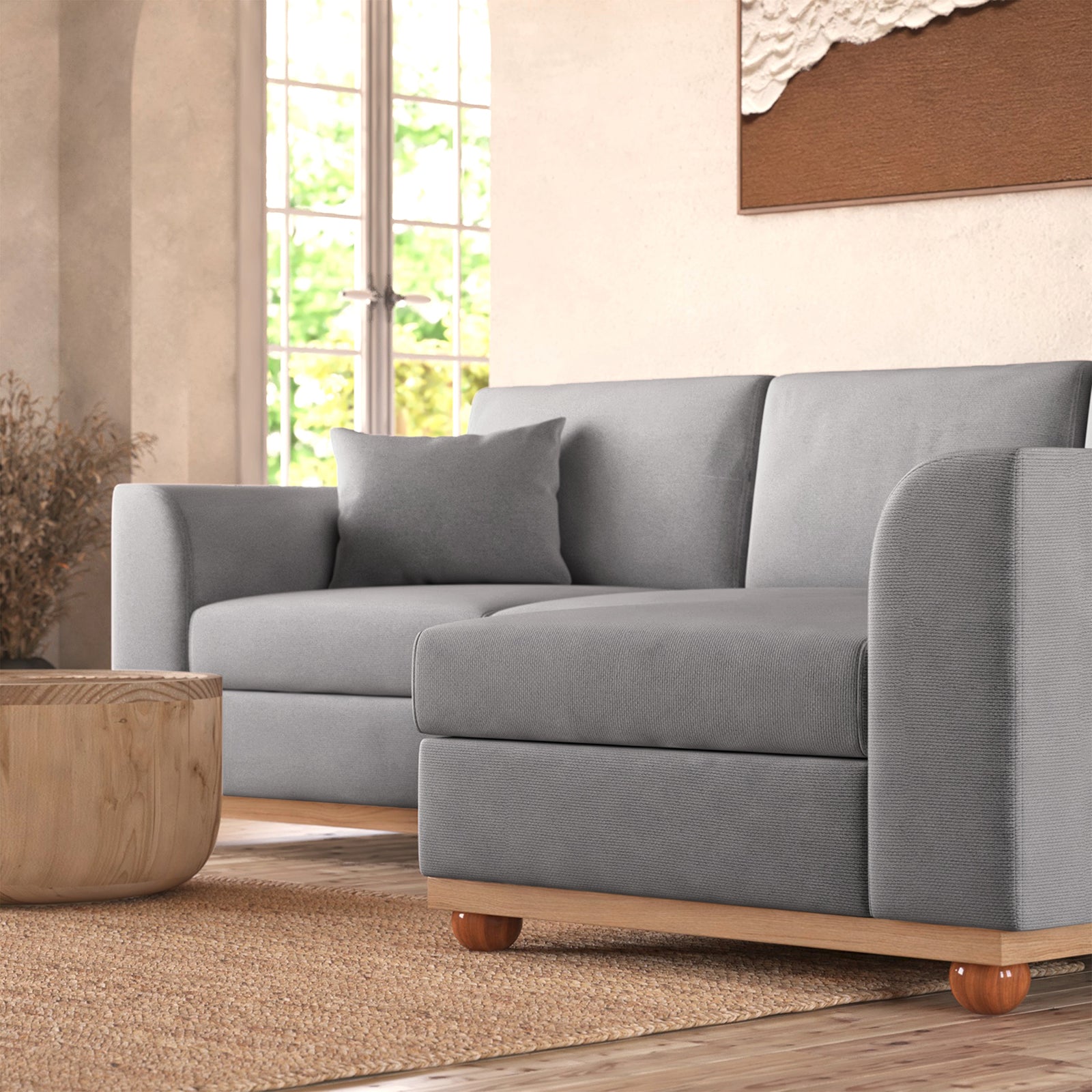 Close-up of the Laylah 3 Seater Hardwood Fabric Sofa With Right Chaise, showcasing its plush fabric, sturdy wooden legs, and elegant design, highlighting comfort and durability for modern living spaces.